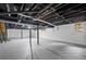 Unfinished basement with painted walls, a door to the outside, and exposed beams at 3363 Briarcliff Ne Rd, Atlanta, GA 30345