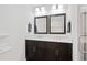 Bright bathroom featuring a double sink vanity with a marble countertop and dark cabinets at 3363 Briarcliff Ne Rd, Atlanta, GA 30345