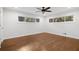 Cozy bedroom with hardwood floors, a ceiling fan, and natural light from the windows at 3363 Briarcliff Ne Rd, Atlanta, GA 30345