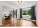 Bright dining room with large windows, hardwood floors, and a view of the outdoors at 3363 Briarcliff Ne Rd, Atlanta, GA 30345