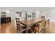 Open dining area with a large wooden table, hardwood floors, and sliding door access to the exterior at 3363 Briarcliff Ne Rd, Atlanta, GA 30345