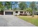 Well maintained home showing the driveway and manicured lawn at 3363 Briarcliff Ne Rd, Atlanta, GA 30345