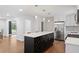 Stylish kitchen island with white countertop, black base, wine rack and stainless steel appliances at 3363 Briarcliff Ne Rd, Atlanta, GA 30345