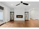 Bright living room featuring a modern fireplace, hardwood floors, and built-in shelving at 3363 Briarcliff Ne Rd, Atlanta, GA 30345