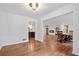 Open-concept living room with hardwood floors flowing into the kitchen and dining area at 3363 Briarcliff Ne Rd, Atlanta, GA 30345