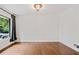 Bright living room featuring hardwood floors, white trim, and a large window at 3363 Briarcliff Ne Rd, Atlanta, GA 30345
