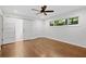 Bright main bedroom with hardwood floors, ceiling fan, and ensuite bathroom at 3363 Briarcliff Ne Rd, Atlanta, GA 30345