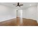 Spacious bedroom with hardwood floors, ceiling fan, and modern ensuite bathroom at 3363 Briarcliff Ne Rd, Atlanta, GA 30345