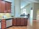 Open kitchen with stainless steel appliances, granite countertops and hardwood flooring at 120 Chastain Nw Rd # 1803, Kennesaw, GA 30144