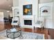 Cozy living room with a fireplace, built-in shelving, and comfortable seating at 120 Chastain Nw Rd # 1803, Kennesaw, GA 30144