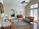 Inviting living room with hardwood floors and natural light from a large window at 120 Chastain Nw Rd # 1803, Kennesaw, GA 30144