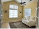 Bright living room featuring comfortable seating, a ceiling fan, and french doors at 120 Chastain Nw Rd # 1803, Kennesaw, GA 30144
