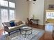 Bright, open-concept living area with hardwood floors and lots of natural light at 120 Chastain Nw Rd # 1803, Kennesaw, GA 30144