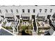 An aerial view of a complex with townhomes, patios, and outdoor seating areas at 210 Calypso Cir, Atlanta, GA 30305