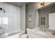 Bathroom featuring a modern tub/shower, stylish vanity, and contemporary lighting at 210 Calypso Cir, Atlanta, GA 30305