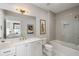 Bathroom with a tub/shower combo, white vanity, and stylish decor at 210 Calypso Cir, Atlanta, GA 30305