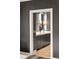 A well lit powder room with gray cabinets and a light countertop at 210 Calypso Cir, Atlanta, GA 30305