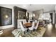 Sophisticated dining room with designer lighting, fireplace, and seating for eight at 210 Calypso Cir, Atlanta, GA 30305