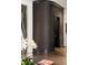 Stylish entryway featuring rounded wall with dark textured wallpaper, and dark wood floors at 210 Calypso Cir, Atlanta, GA 30305