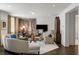 Bright living room with hardwood floors, white walls, and neutral-toned furniture at 210 Calypso Cir, Atlanta, GA 30305
