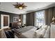 This bedroom is designed with a spacious layout and features elegant decor and furnishings at 210 Calypso Cir, Atlanta, GA 30305