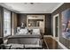 Dark-walled primary bedroom features a large bed, modern decor, and plenty of natural light at 210 Calypso Cir, Atlanta, GA 30305