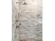 Close up of a glass-enclosed shower showcasing the stone tile backsplash and modern fixtures at 210 Calypso Cir, Atlanta, GA 30305