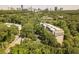 Beautiful aerial view of an apartment complex nestled in lush greenery with the city skyline in the background at 2865 Lenox Road Ne # 602, Atlanta, GA 30324