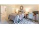 Bedroom featuring a queen bed, a desk, and access to hallway with closet at 2865 Lenox Road Ne # 602, Atlanta, GA 30324