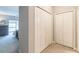 Hallway with closet doors leading into carpeted bedroom with bed, dresser, and window at 2865 Lenox Road Ne # 602, Atlanta, GA 30324