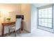Bright home office space with wooden desk next to a large window at 2865 Lenox Road Ne # 602, Atlanta, GA 30324