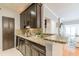 Kitchen featuring granite countertops, stainless steel appliances, and dark wood cabinetry at 2865 Lenox Road Ne # 602, Atlanta, GA 30324