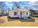 Charming renovated single-story home featuring fresh paint, manicured yard and inviting front porch at 34 N Broad N St, Porterdale, GA 30014