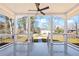 Welcoming front porch with stylish railings, ceiling fan, and an inviting entry into the home at 34 N Broad N St, Porterdale, GA 30014