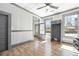 Eat-in kitchen boasts tile floors, gray cabinets, stainless appliances, and lots of natural light at 34 N Broad N St, Porterdale, GA 30014