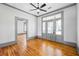 Inviting living room showcases hardwood floors, neutral paint, classic trim, and glass doors to the porch at 34 N Broad N St, Porterdale, GA 30014