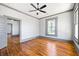 Spacious living room boasts hardwood floors, neutral paint, large windows, and classic architectural details at 34 N Broad N St, Porterdale, GA 30014