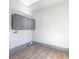 Small room with tile flooring, gray accent, and gray storage cabinets at 34 N Broad N St, Porterdale, GA 30014
