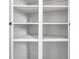 Bright white built-in shelves and storage cabinets with multiple doors at 34 N Broad N St, Porterdale, GA 30014