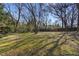 A spacious and private backyard with a wooden fence and mature trees provides a serene outdoor space at 4223 Mountain Glen Trce, Snellville, GA 30039