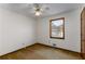 Bedroom with a window for natural light, ceiling fan, and carpet flooring at 4223 Mountain Glen Trce, Snellville, GA 30039