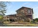 Exterior view of a two-story home with siding, deck, staircase, and windows at 4223 Mountain Glen Trce, Snellville, GA 30039