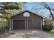 A two-car garage with traditional doors and a basketball hoop provides ample parking and recreational space at 4223 Mountain Glen Trce, Snellville, GA 30039