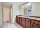 Bathroom featuring double sinks and large mirror at 1276 Clay Sw Rd, Mableton, GA 30126