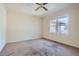 Bedroom with neutral carpet, ceiling fan and a single window for natural light at 1276 Clay Sw Rd, Mableton, GA 30126