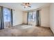 Bedroom with neutral carpet, ceiling fan and two windows for natural light at 1276 Clay Sw Rd, Mableton, GA 30126