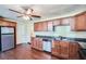 Kitchen boasting ample cabinets, stainless steel dishwasher, and hardwood floors at 1276 Clay Sw Rd, Mableton, GA 30126