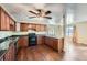 Kitchen view showing stainless steel appliances with bar top dining and connection to living area at 1276 Clay Sw Rd, Mableton, GA 30126