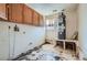 Utility room with a hot water heater, storage and a single window for natural light at 1276 Clay Sw Rd, Mableton, GA 30126