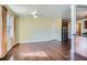 Open-concept living space with hardwood floors, adjacent to the kitchen at 1276 Clay Sw Rd, Mableton, GA 30126